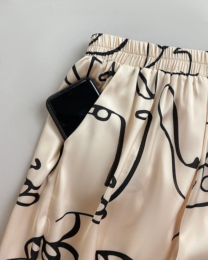 Women's Abstract Face Print Two Piece Outfits Boat Neck Batwing Sleeve Top and High Waisted Wide Leg Pants Set with Pockets - Image 6